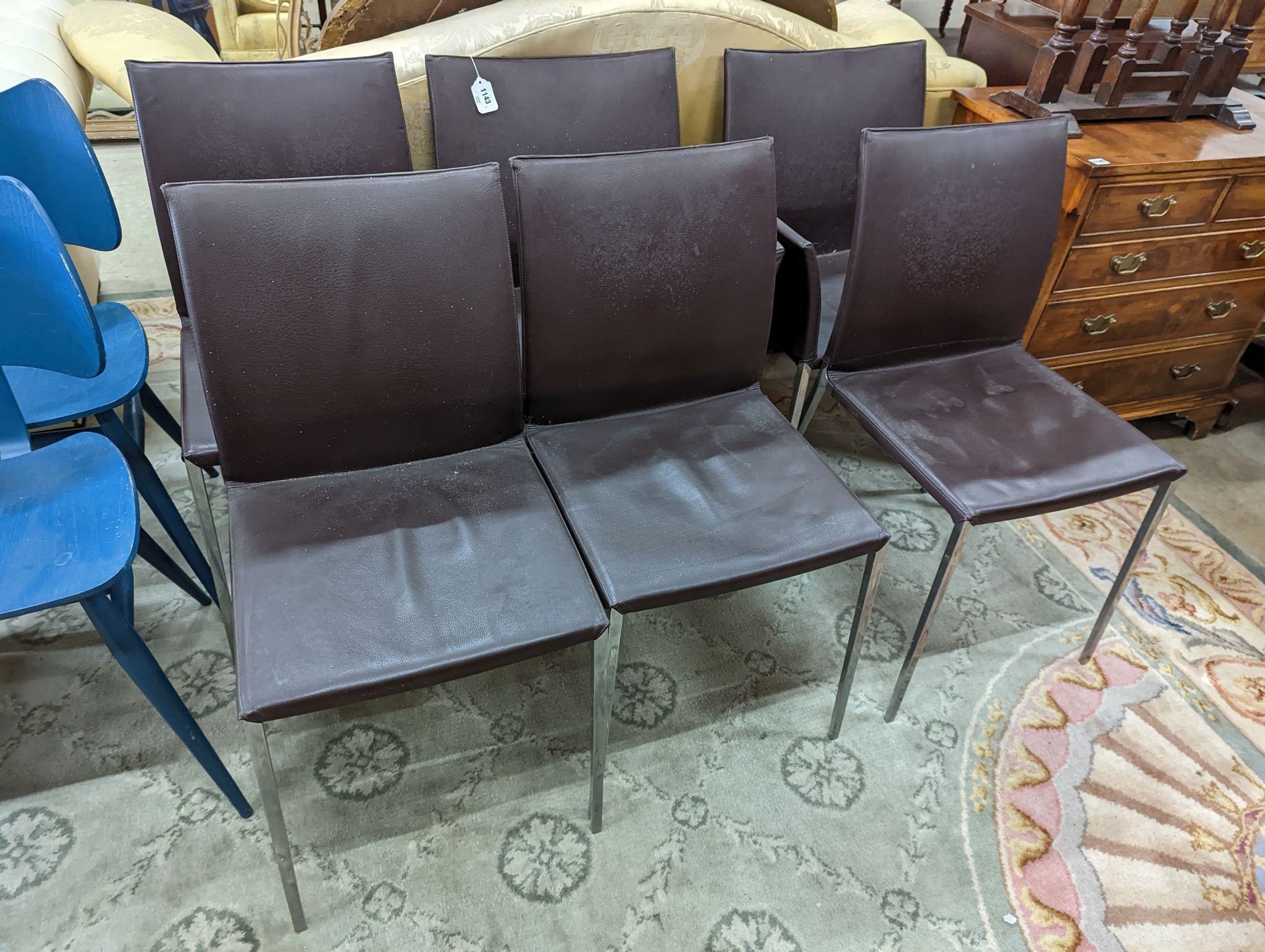 A set of six contemporary brown leather dining chairs